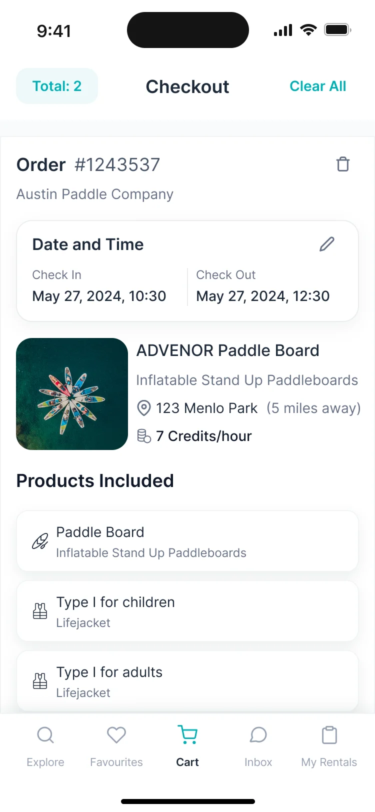 Cart on a phone: a paddle board with a time slot, added services and the total in credits