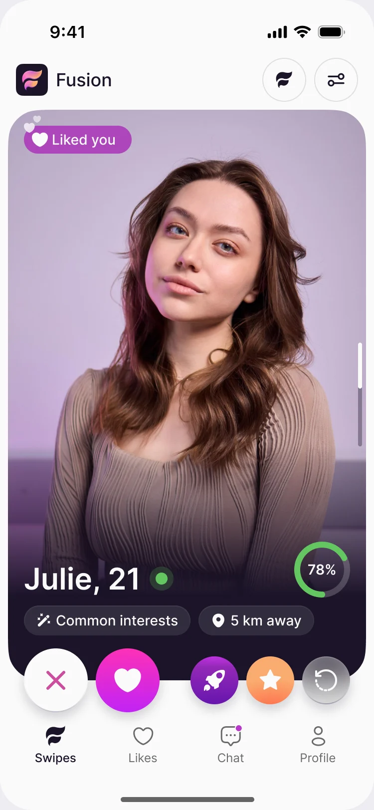 Fusion discovery card in Fusion mode: a Liked you tag, Julie, 21 with an online dot and a 78% compatibility ring, Common interests and 5 km away chips, pass, like, boost, super like and rewind buttons, and the Swipes, Likes, Chat and Profile tab bar