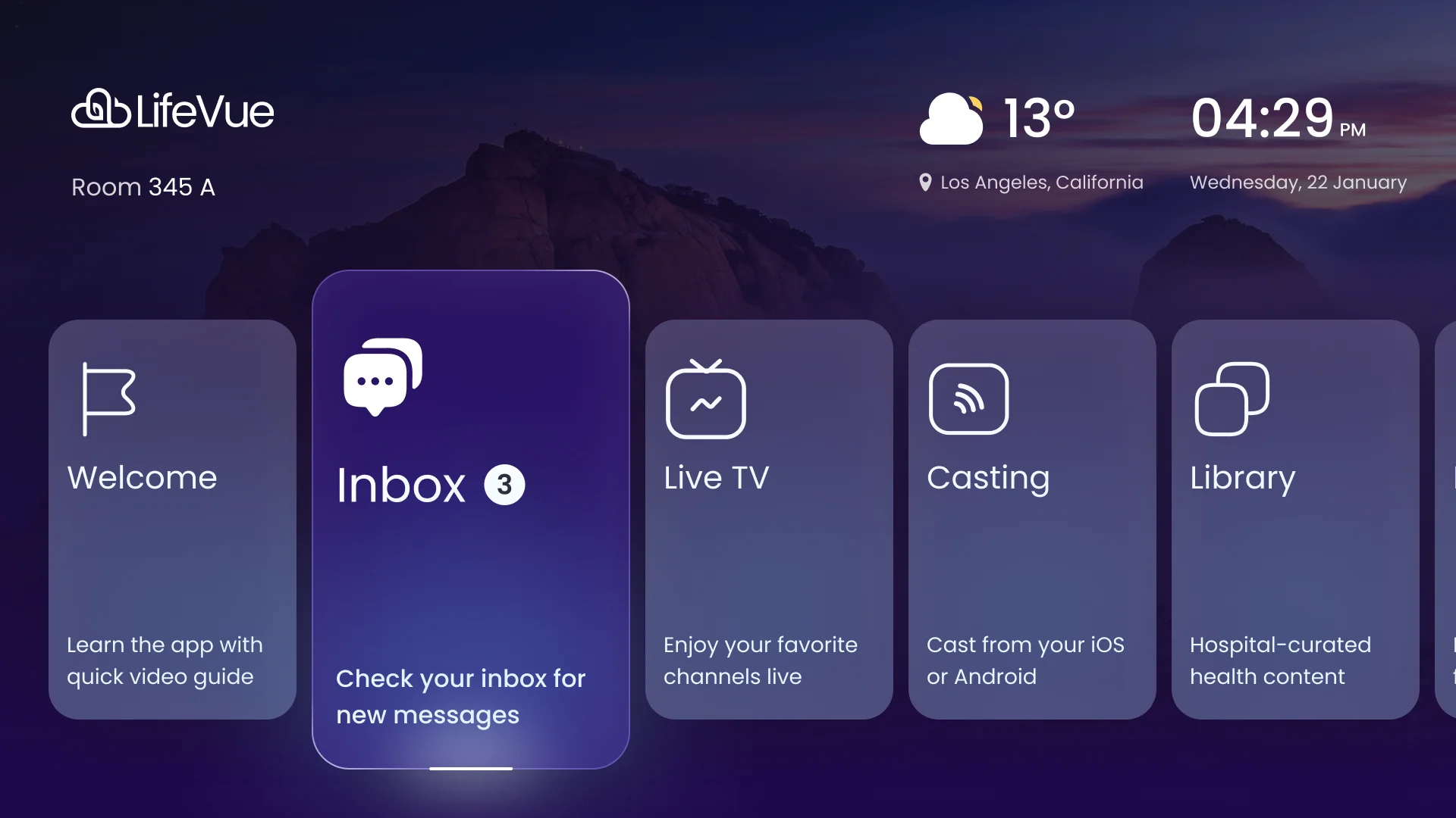 LifeVue home hub with Inbox in focus: the logo and room number top left, the weather and time top right, the raised Inbox card with its unread count and the Welcome, Live TV, Casting and Library cards around it