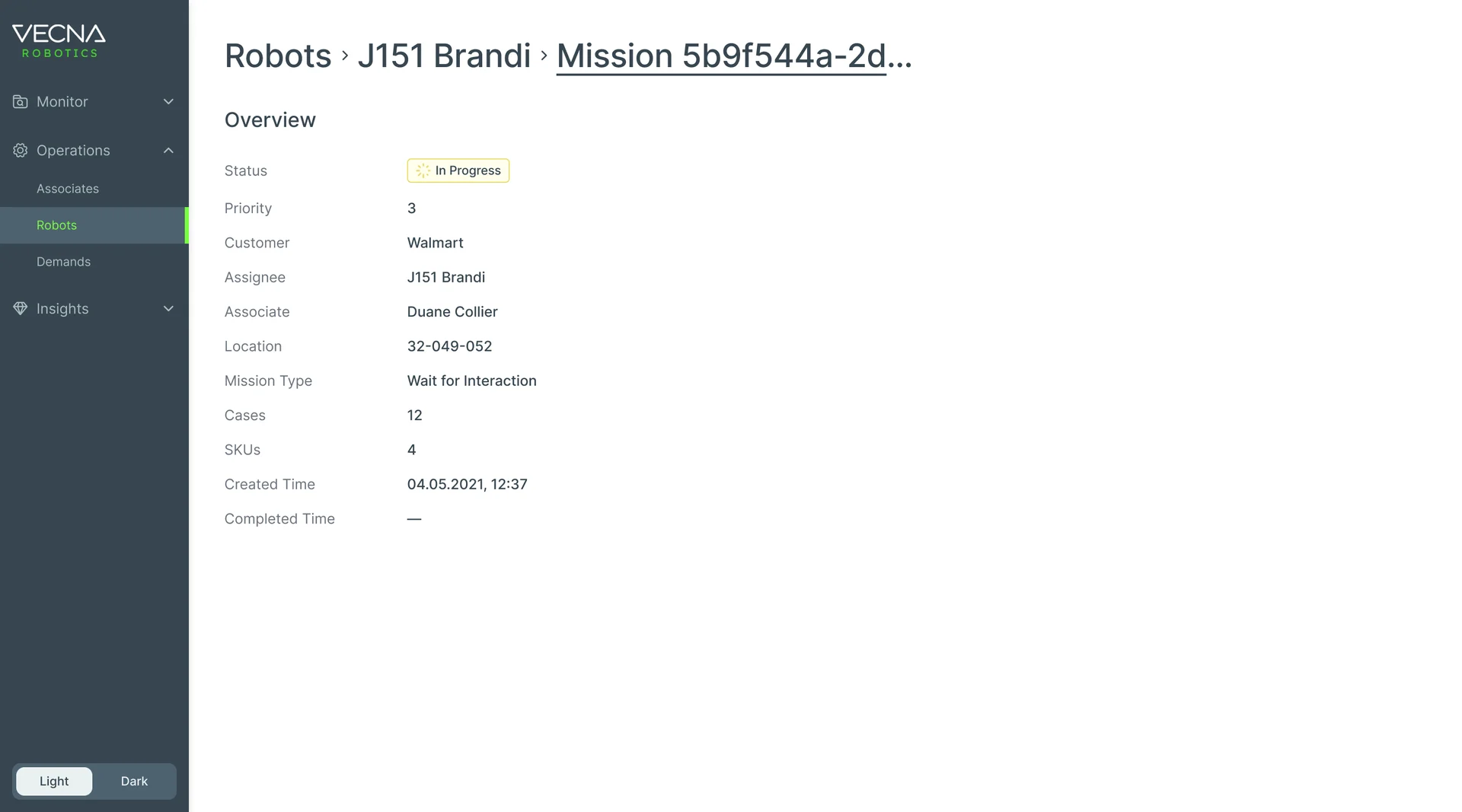 Console mission page for robot J151 Brandi: status in progress, priority 3, customer Walmart, the associate, location 32-049-052, mission type Wait for Interaction, 12 cases, 4 SKUs, demand type and created time