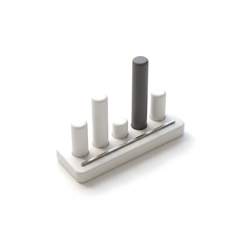 A white ceramic bar chart of five rounded bars on a steel baseline, one bar in graphite.