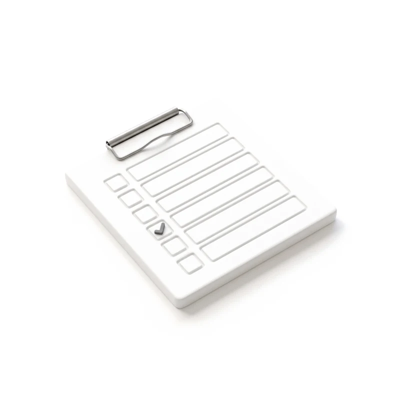A white ceramic clipboard carved with a checklist, held by a steel clip, one tick in graphite.