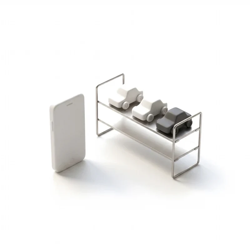 A ceramic phone beside a short steel shelf holding three small ceramic cars, one in graphite.