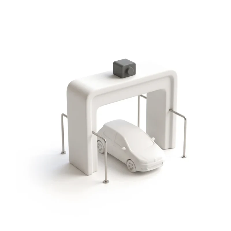A ceramic car-wash arch on steel posts with a small ceramic car under it, a graphite camera on top.
