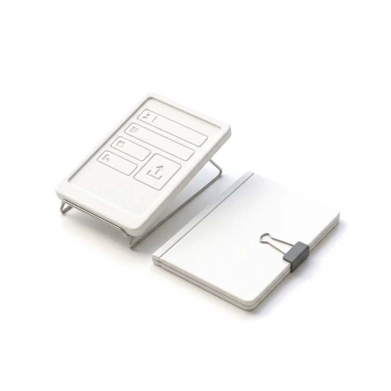 A white ceramic tablet on a steel stand carved with a form and an upload box, a closed ceramic folder beside it held by a graphite clip.