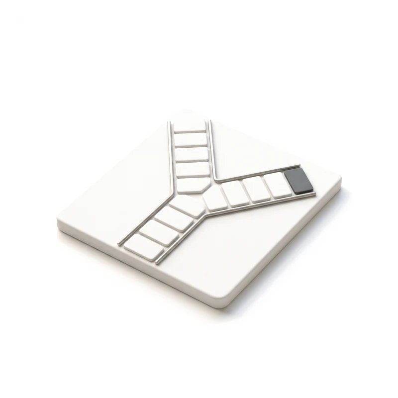 A white ceramic base where one path of steps splits in two, a graphite tile at the end of one branch.