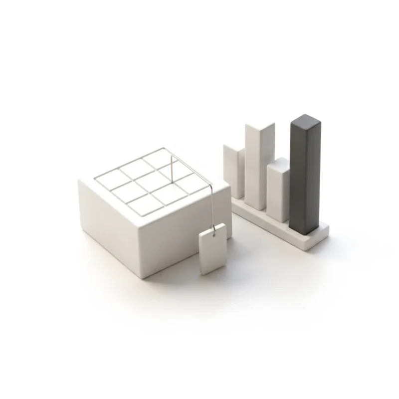 A ceramic table slab with a small tag hanging from one cell, a bar chart of four bars beside it, one bar graphite.