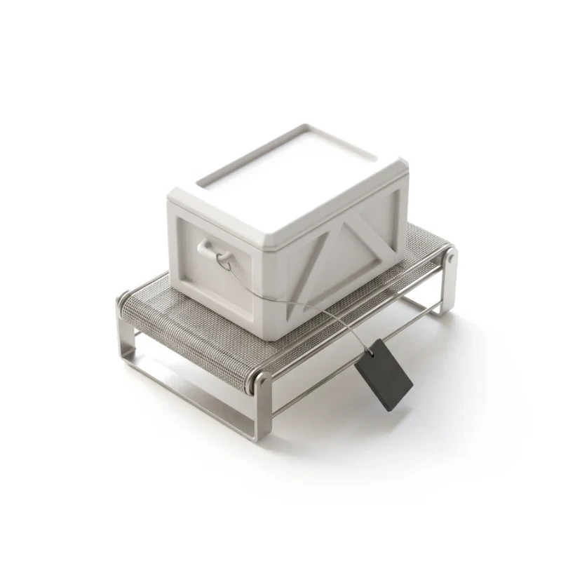 A ceramic crate on a short steel conveyor with a graphite defect tag hanging from it.