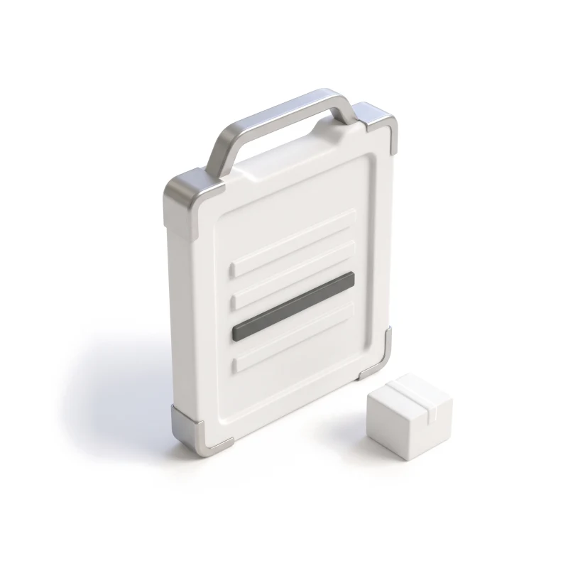 A rugged ceramic tablet with a steel handle and corner guards, one row graphite, beside a small parcel.