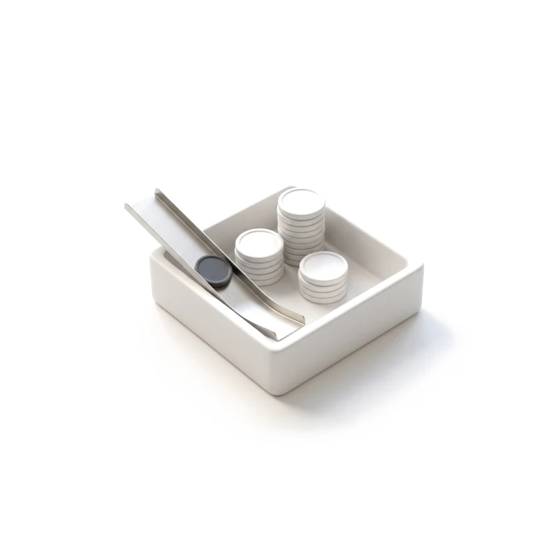 A ceramic tray of coin stacks, a graphite coin sliding in down a steel chute.