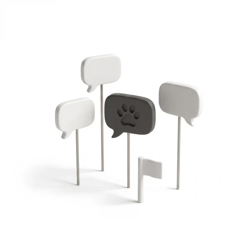 Three ceramic speech bubbles on steel stems around one graphite bubble with a paw print, a small flag pin in front.