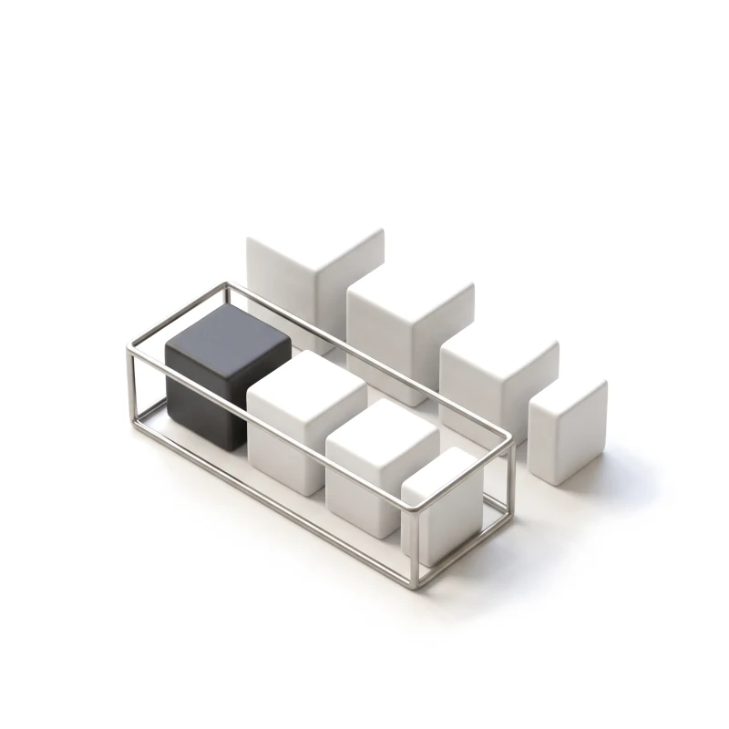 A steel frame encloses the first ceramic blocks in a row, the rest wait outside it.
