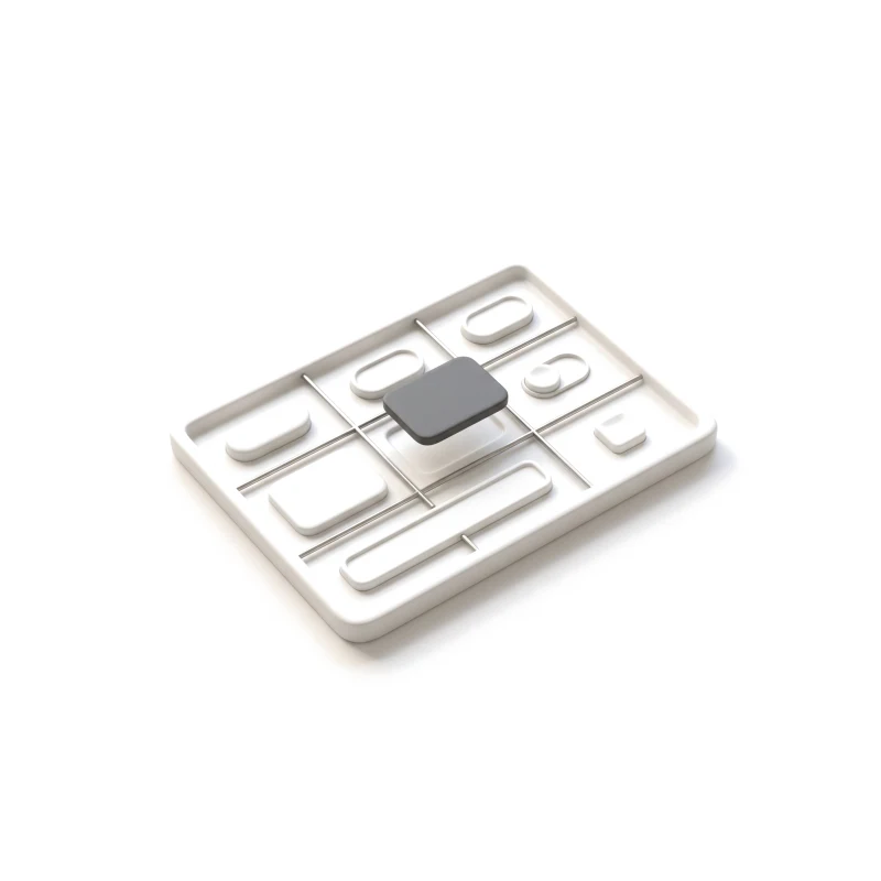 A shallow ceramic tray divided by a steel grid, holding ceramic buttons, a card, an input field and a toggle, one graphite piece lifted above its slot.