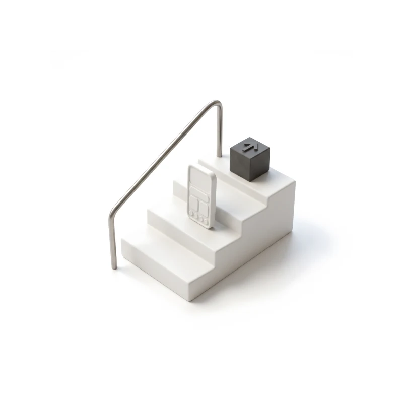 Three white ceramic steps with a steel handrail, a ceramic phone on the middle step and a graphite block with a raised up arrow on the top step.