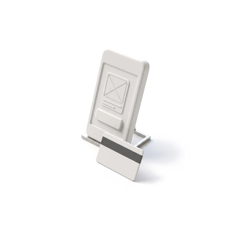 A white ceramic phone on a steel stand, a ceramic pass card with a graphite stripe leaning in front.