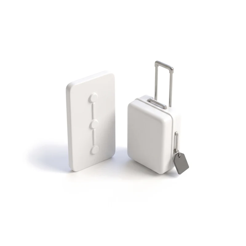 A ceramic phone carved with a trip timeline beside a small ceramic suitcase with a graphite luggage tag.