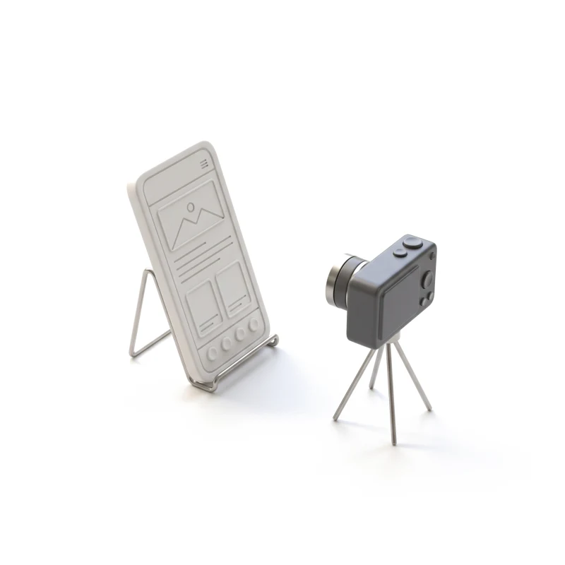 A white ceramic phone on a steel stand, watched by a small graphite camera on a tripod.