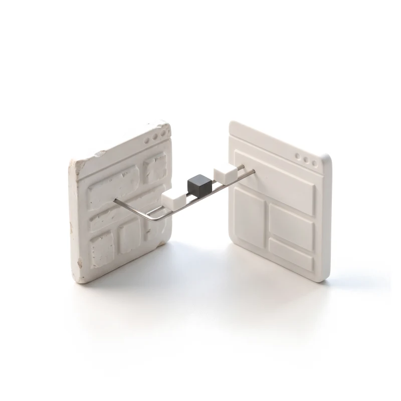 Two ceramic browser windows, one rough and one clean, joined by a thin steel rail carrying small blocks across, one graphite.