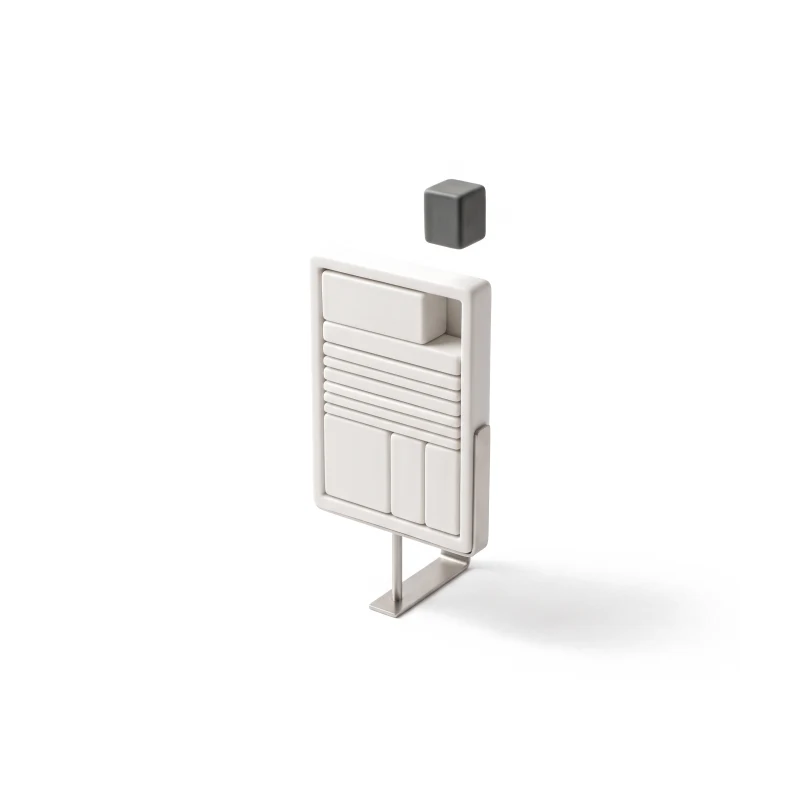 An upright ceramic page frame on a steel stand filled with stacked ceramic content blocks, one graphite block hovering above, about to slot in.