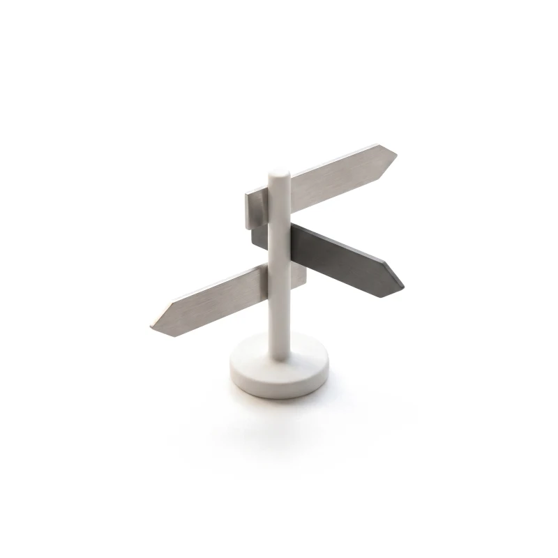 A white ceramic signpost with three thin steel arrow plates pointing different ways, one plate graphite.